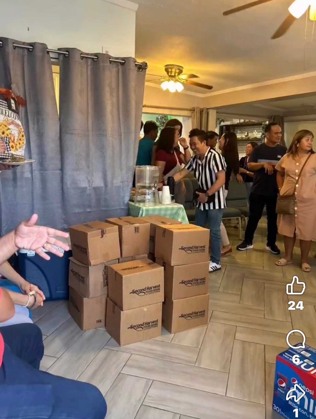 Volunteers with food donation boxes being prepared in a home setting